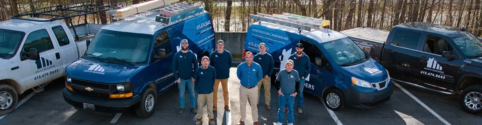 The JACCO Builders crew in front of the company's branded work vans